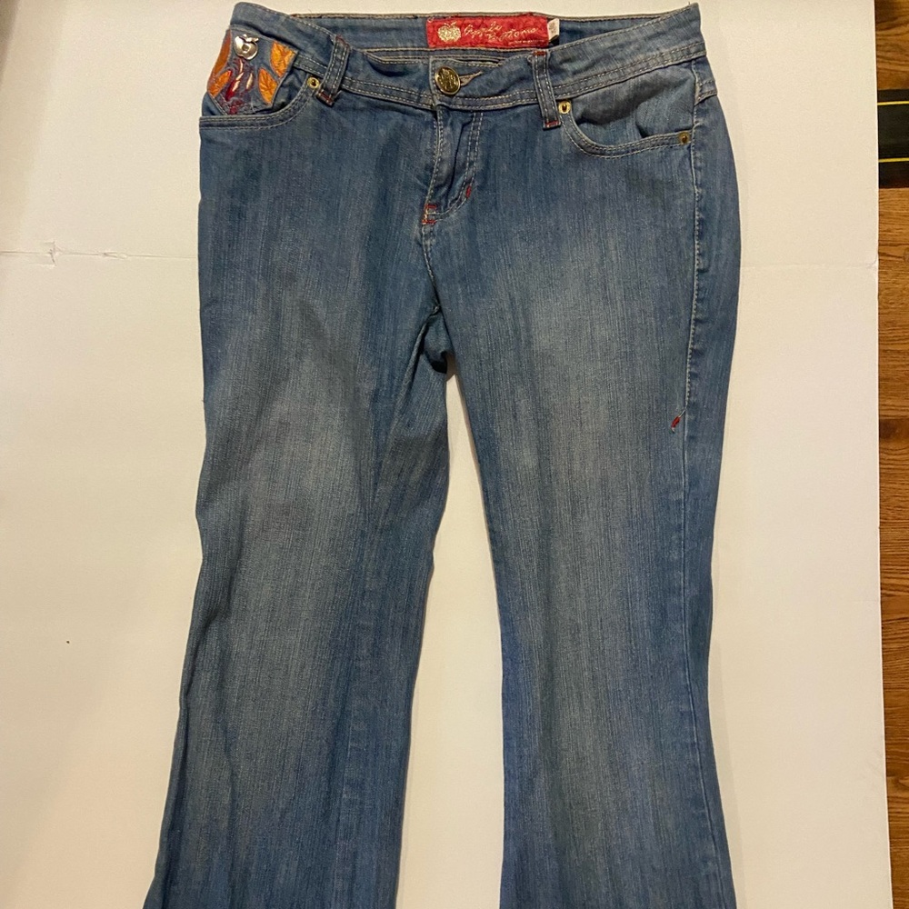 Apple bottom jeans with orange and pink embellishments